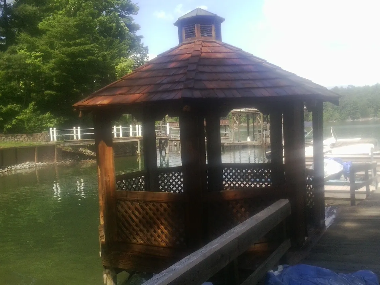 Cedar shake gazebo roof rebuilt on a lake dock in Earling